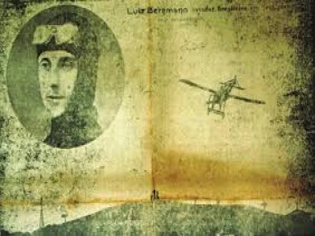 Imagem antiga e desgastada (possivelmente uma foto ou postal) em tons sépia. No lado esquerdo, um retrato circular de um homem (possivelmente o aviador brasileiro Luiz Bergmann, cujo nome aparece parcialmente no topo) usando óculos de voo. No lado direito, o desenho ou fotografia de um avião rudimentar de asas fixas. O fundo parece ser de um papel envelhecido e manchado.